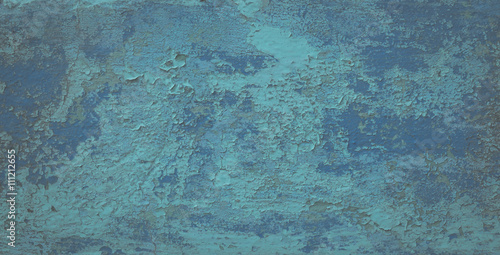 Old weathered paint on a concrete wall. Blue abstract background.