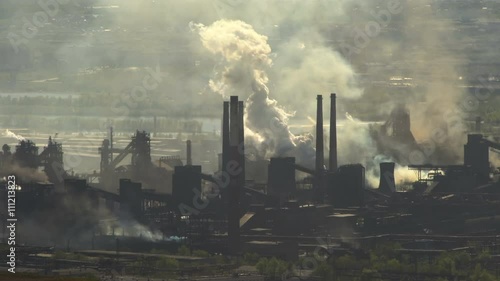 Pollution Large Factory Industry Against the Backdrop of City Buildings in the Summer
