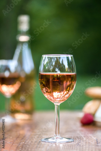 Wine glass is the center of attention in the pretty outdoor sett