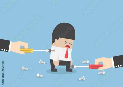 Big hand trying to repair businessman by tightening a screw nut