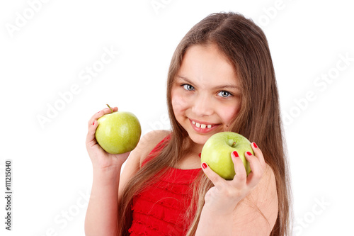 Young girl holding apples