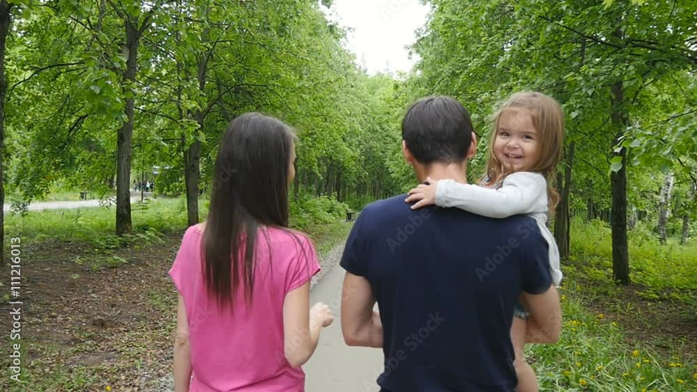 Happy Family on the Walk in Forest Happy Family on the Walk in Forest
