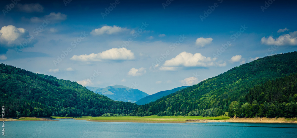 Mountain Lake with blue mountains in the background