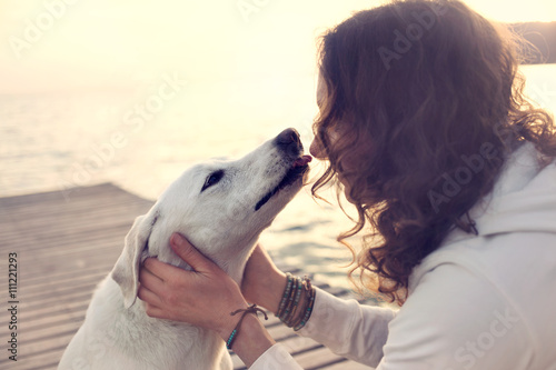 His owner dog licks gently, loving gesture
