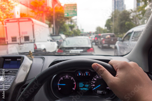 The Man hand driving car on the traffic jam , digital effect sunlight © scofieldza