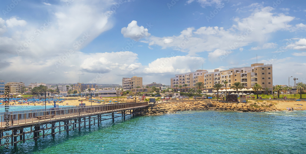 The pier and the beach of Protaras on a sunny day. Protaras. Cyprus.