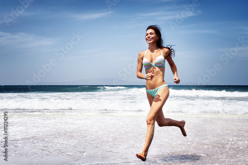 Woman running on a beach