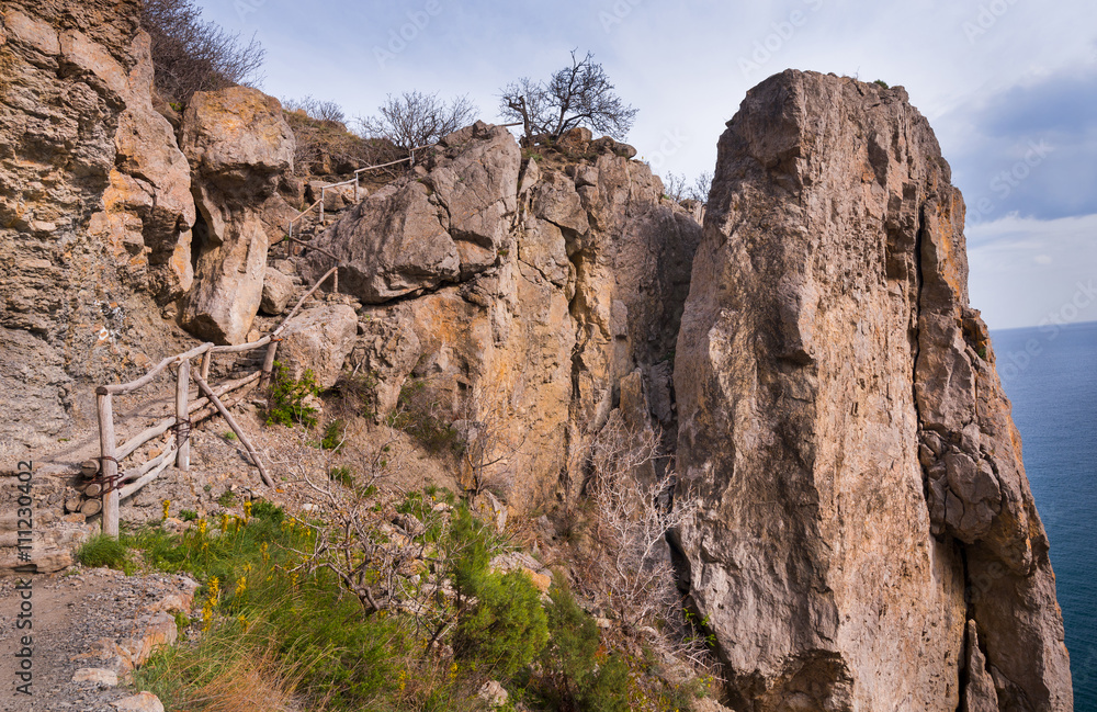Hiking path through red rocks in Crimea