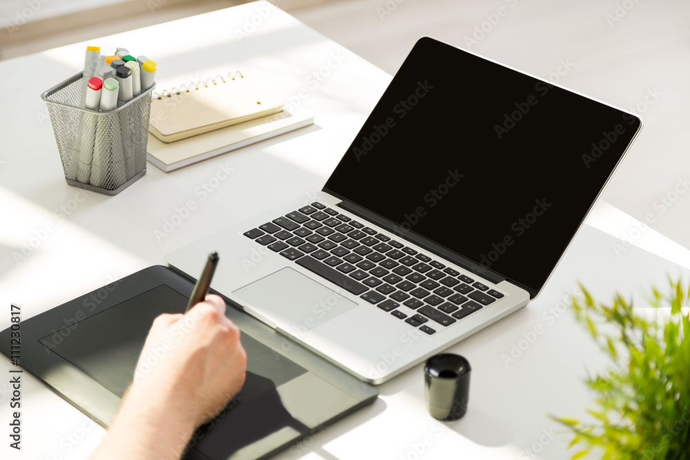 Fototapeta premium Man using graphic tablet