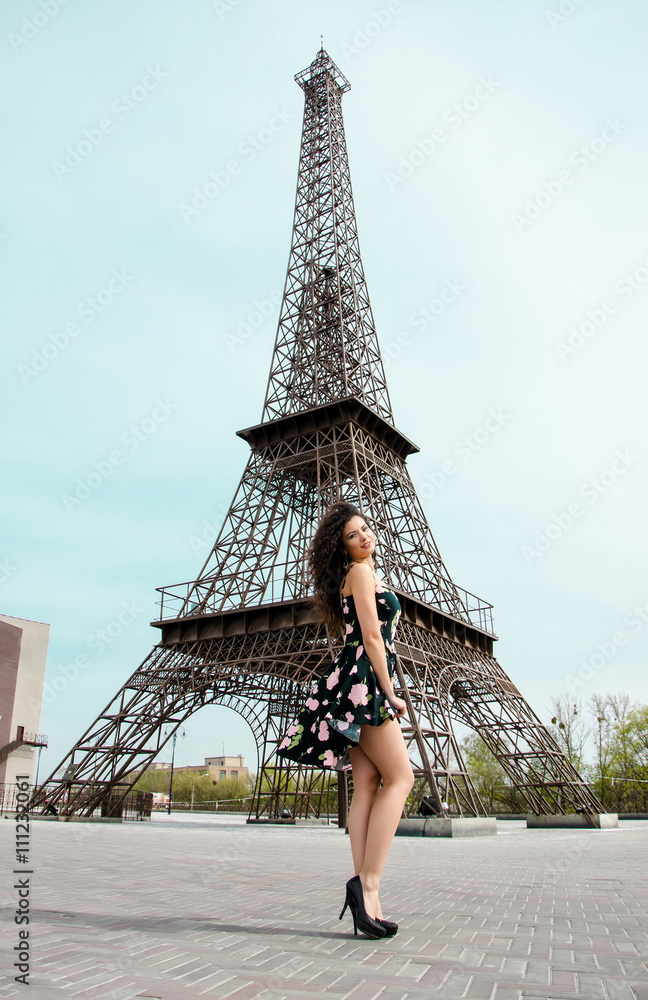 Woman in dress, near the Eiffel Tower