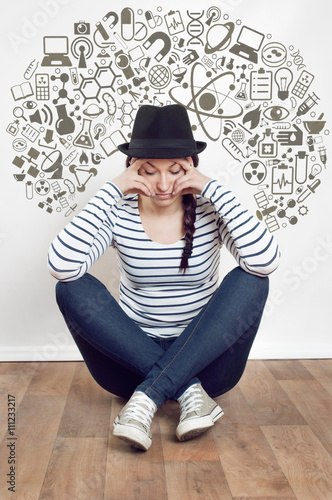 Sad woman sitting alone in a empty room