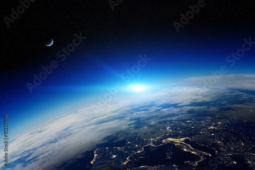 Fototapeta Naklejka Na Ścianę i Meble -  Sunrise over planet Earth in space