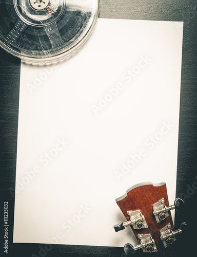 Movie Film Music Writing on Blank paper. Vintage movie film on blank paper can be use for Screenplay writing, Movie title, Video title, Movie credit, Film Music score, Music Video Text. photo