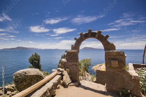 arch above titicaca lake in peru photo