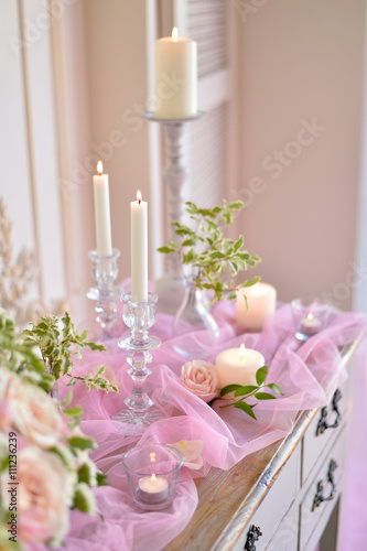 wedding candles and flowers on table 