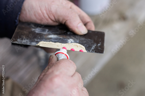 Body filler preparing for car repare.