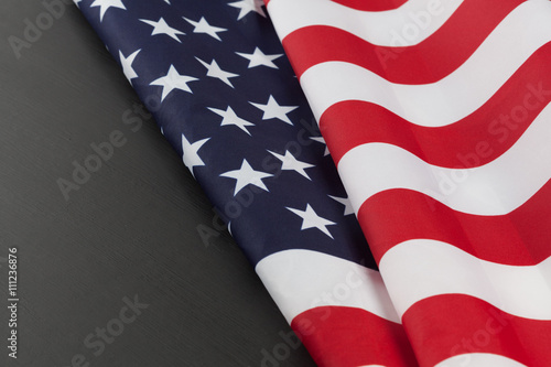 USA flag folds on black chalkboard. Horizontal image with copy space