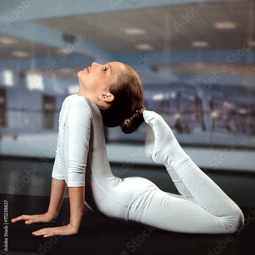 Obraz na plátně beautiful girl gymnast doing exercises