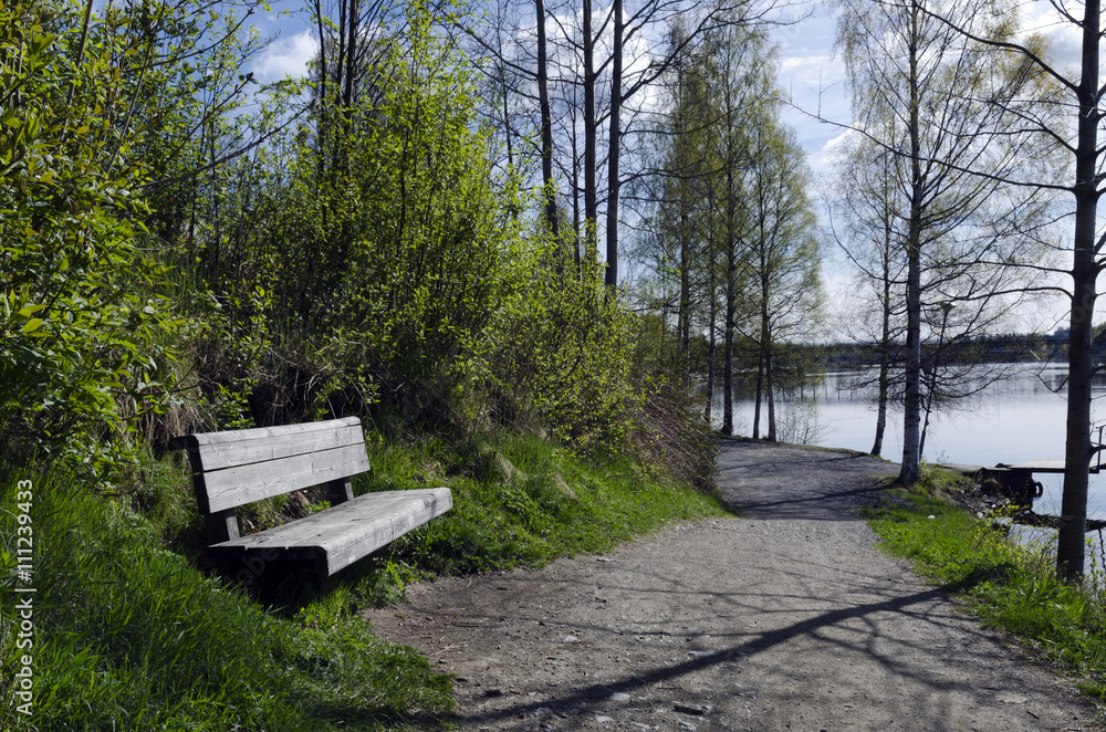 Wooden rest bench near the river, from the North of Sweden. 