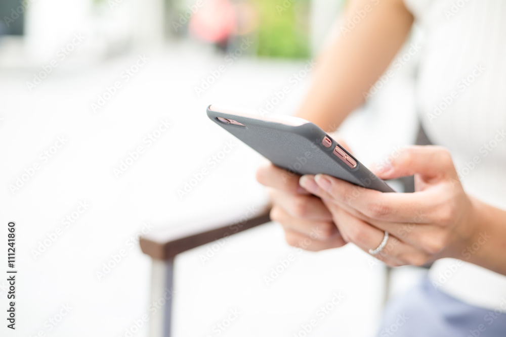 Woman hand holding cellphone