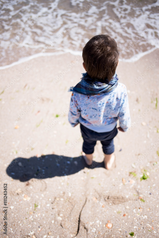 wind blowing little boy's hair and scarf wind blowing little boy's hair and scarf