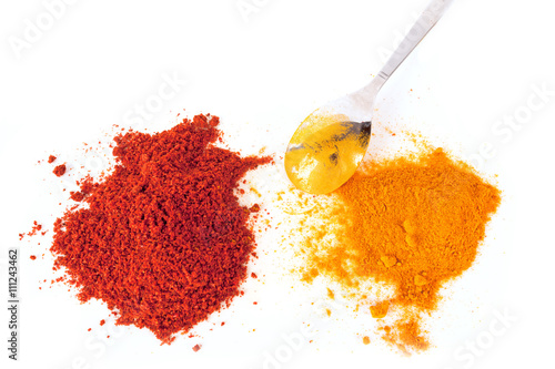 Obraz na plátně Turmeric (Curcuma) and Paprika powder with spoon isolated on white