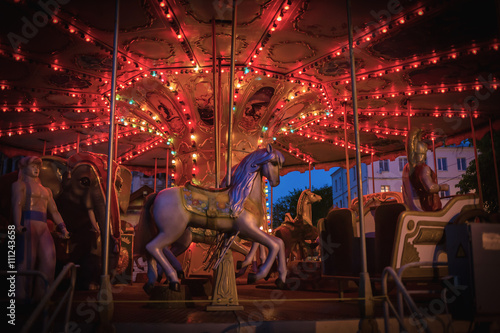 Night children's carousel with lights