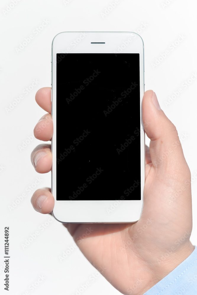 Closeup on hand holding black screen smartphone on white background