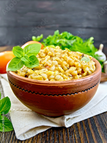 Barley porridge with basil on napkin