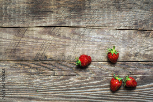 Strawberry on wood background