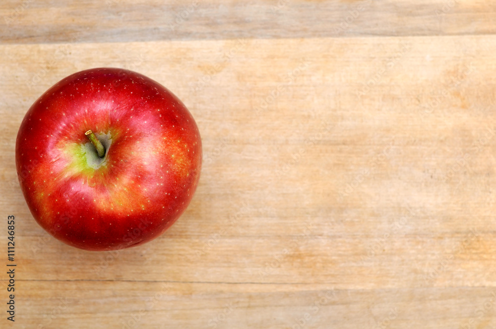 Red apple on wooden table background Red apple on wooden table background