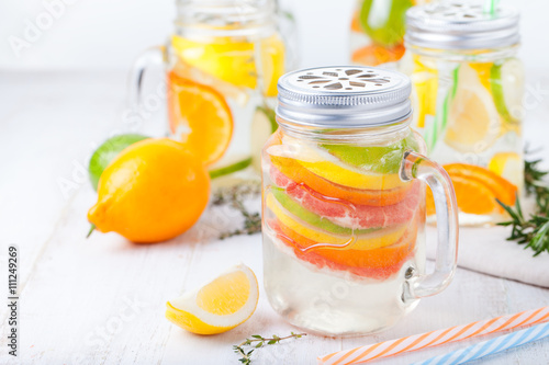 Detox fruit infused flavored water. Refreshing summer homemade lemonade cocktail