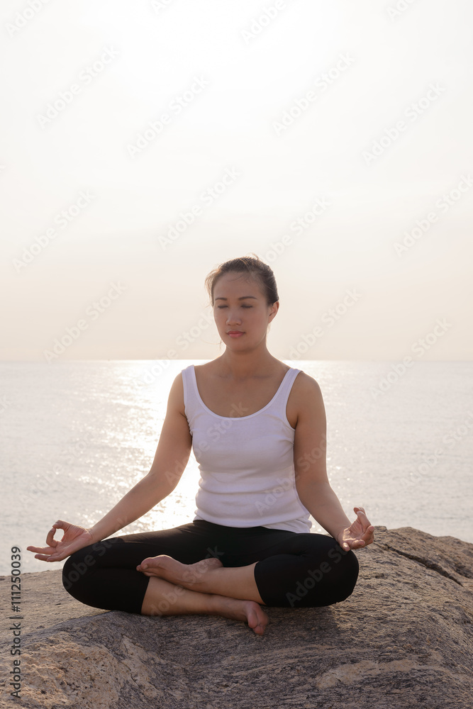 young woman practicing yoga