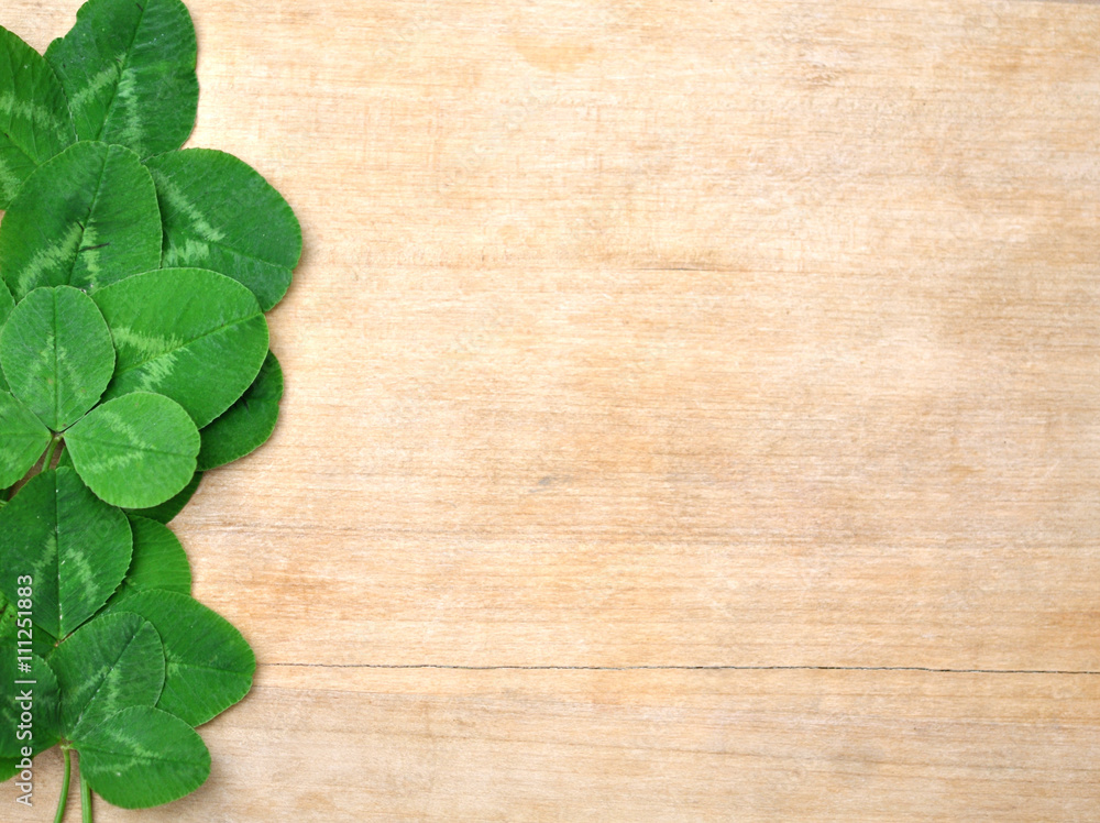 leaves clover on wooden background leaves clover on wooden background
