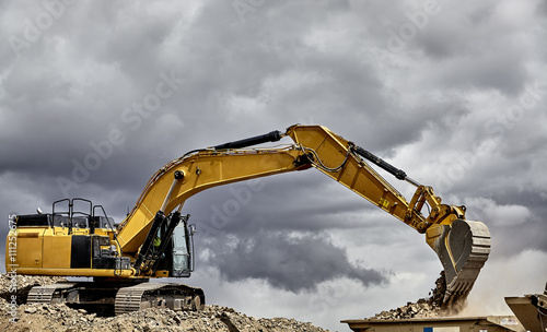 Construction industry excavator with portable quarry machine