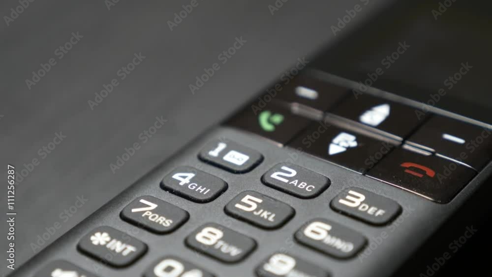 Modern cordless phone hi-tech design in office 4K 2160p 30fps UltraHD footage - Portable fixed telephone line device on the table 4K 3840X2160 UHD video Modern cordless phone hi-tech design in office 4K 2160p 30fps UltraHD footage - Portable fixed telephone line device on the table 4K 3840X2160 UHD video