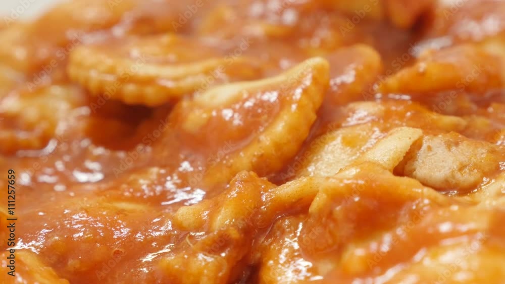 Dough ravioli in the tomato sauce with cheese food background 4K 2160p 30fps UltraHD slow tilt video - Filled with meat ravioli pasta dough served for lunch 4K 3840X2160 UHD footage Dough ravioli in the tomato sauce with cheese food background 4K 2160p 30fps UltraHD slow tilt video - Filled with meat ravioli pasta dough served for lunch 4K 3840X2160 UHD footage