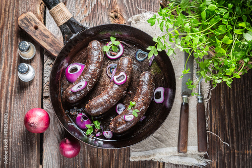 Photography Hot black pudding with onion and parsley