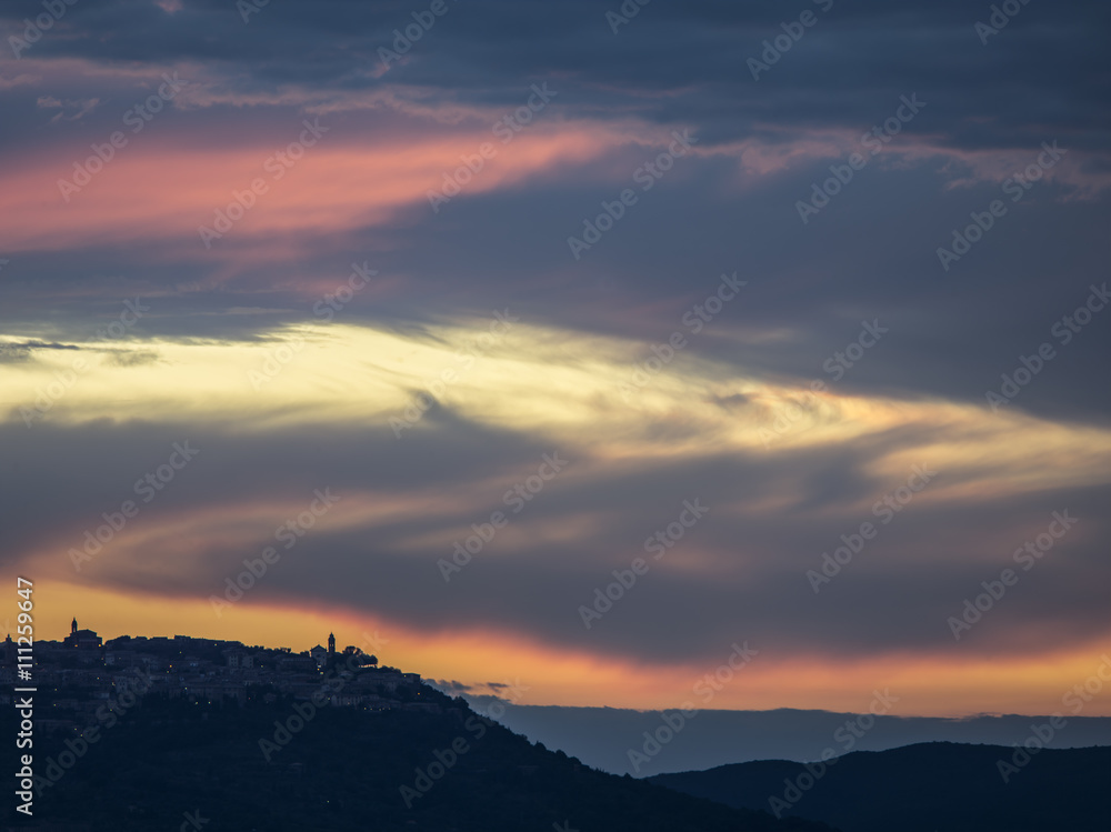 dawn sky above the mountains of tuscany, italy
