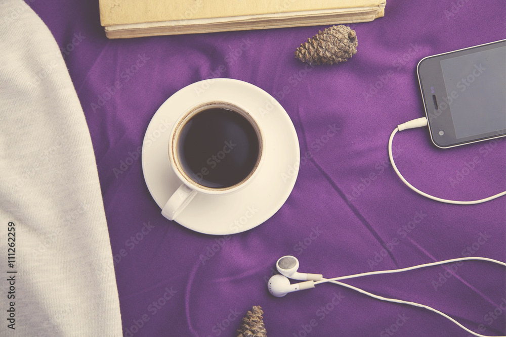 coffee and phone on bed - obrazy, fototapety, plakaty 