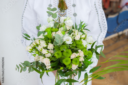 Beautiful bride with bouquet before wedding ceremony