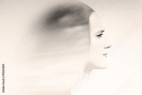 double exposure of beautiful woman with sky