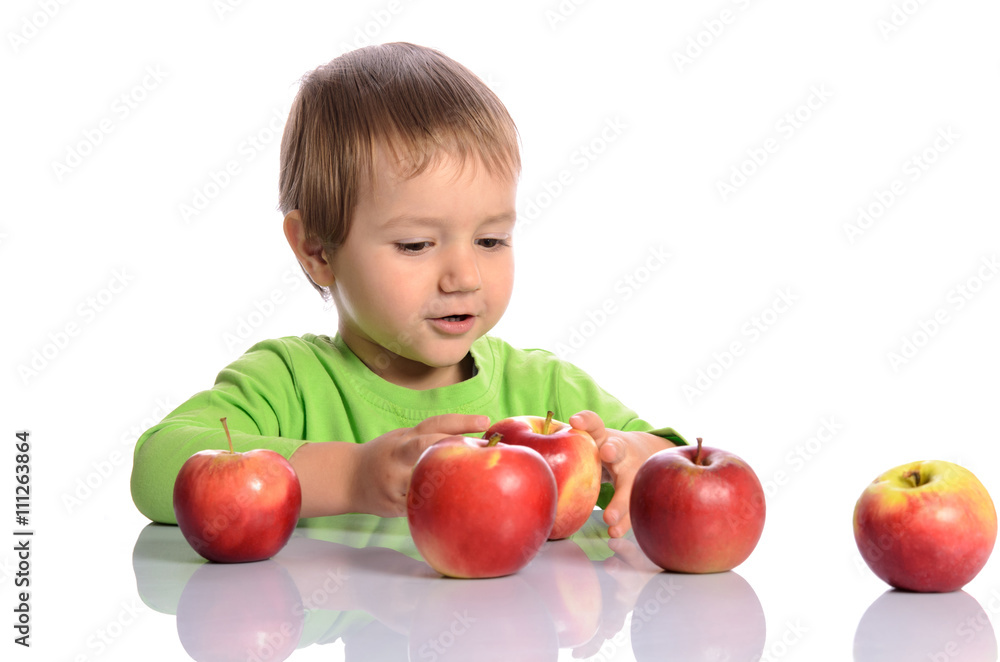 Cute child with red apples on white background Cute child with red apples on white background