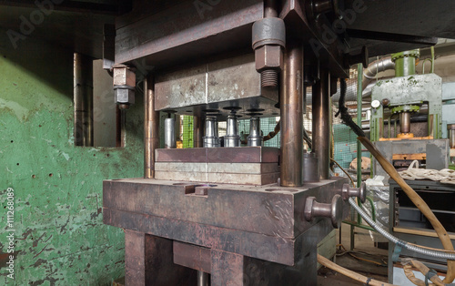 Hydraulic press close-up. Machinery plant.