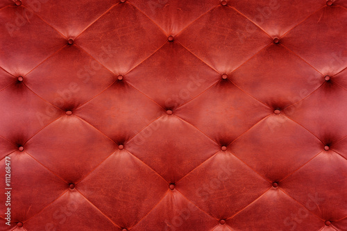Genuine red leather upholstery background for a luxury decoratio