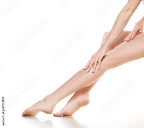 woman legs isolated on white. Depilation or another healths concept