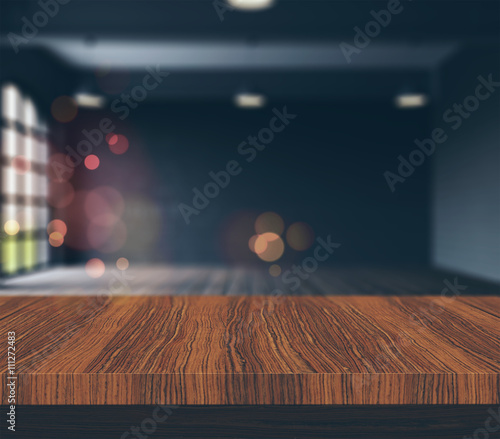 Fototapeta 3D wooden table looking to a defocussed empty room with vintage