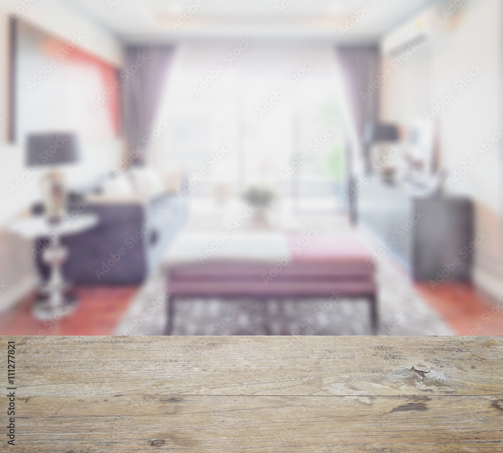 wooden table top with blur of classic style living room interior with sofa and bench wooden table top with blur of classic style living room interior with sofa and bench