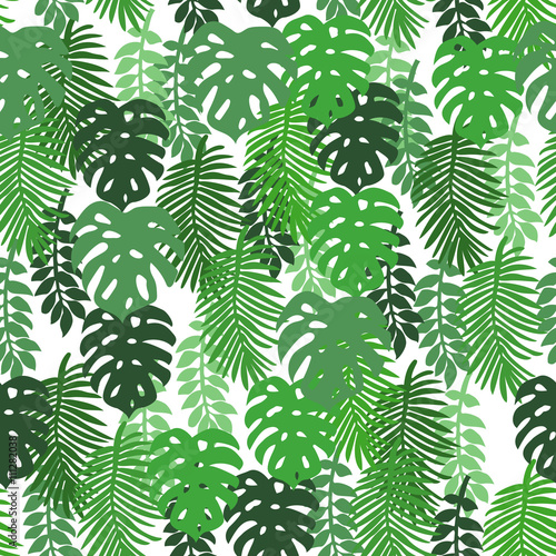 On a white background tropical leaves. Pattern seamless
