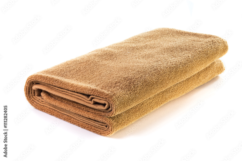 Brown soft bath towel isolated on white background Brown soft bath towel isolated on white background